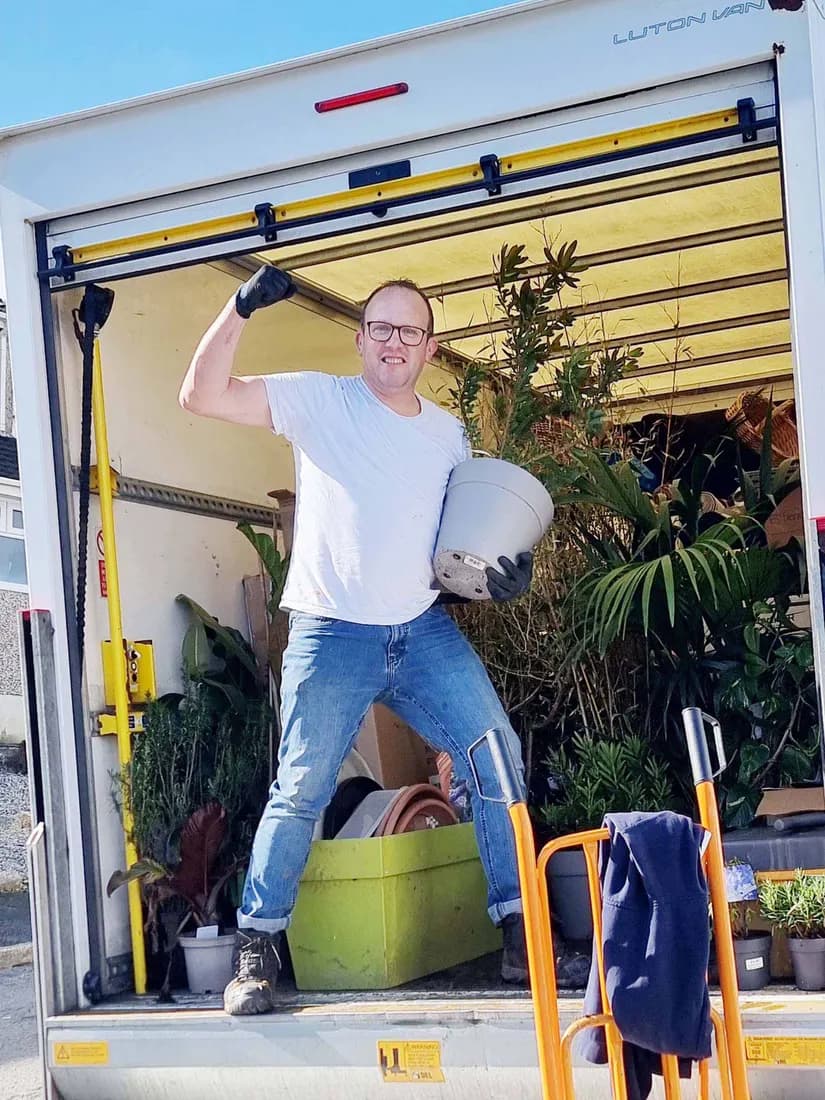 Eddy loading a customer's belongings into the Luton van