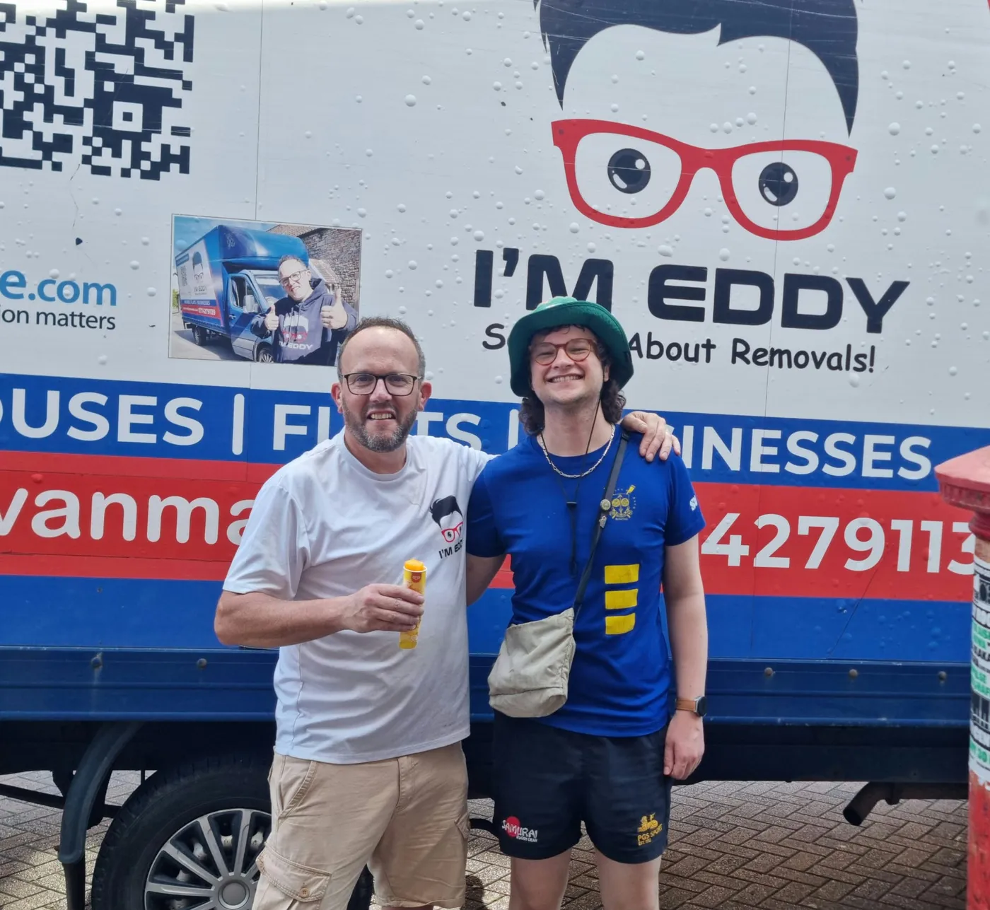 Eddy beside the branded removal van on a customer job